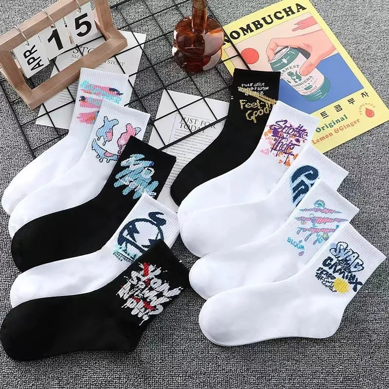 10 pairs of white cotton tube socks with graffiti pattern, middle calf length, on a plain background