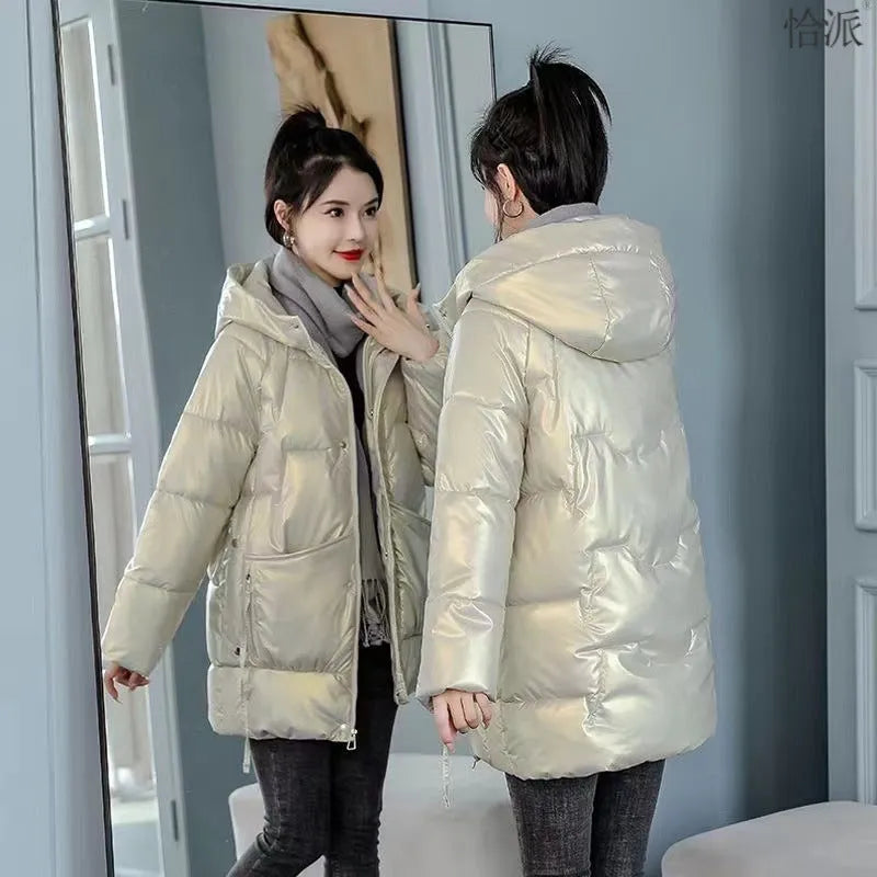 Women's loose fit hooded winter jacket in polyester blend available in four colours with Asian sizing.