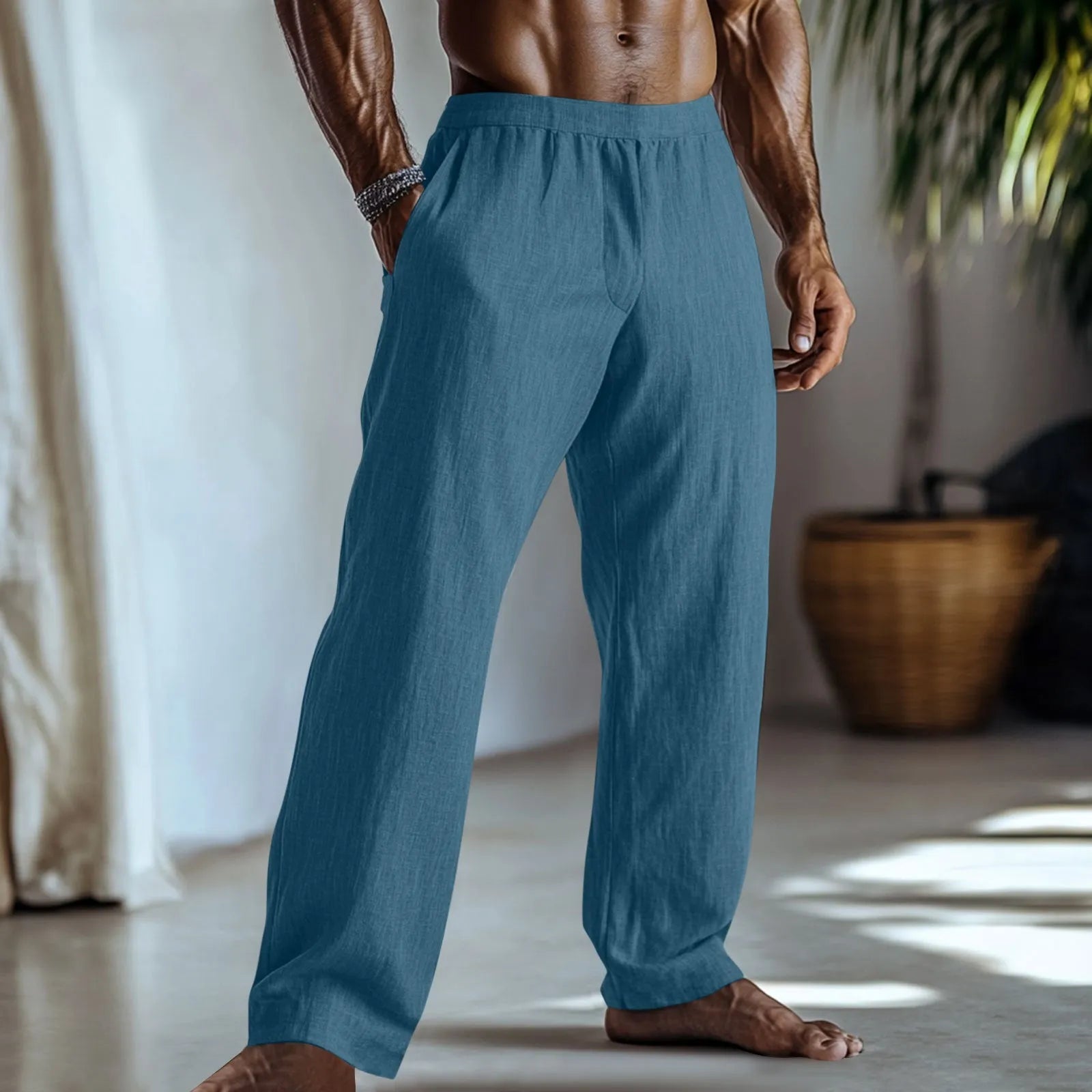 Straight-leg casual trousers in cotton and linen fabric on a hanger, showing light green colour and pocket detail