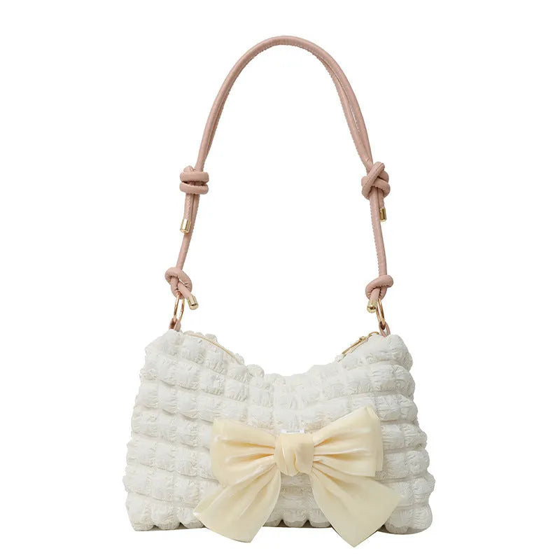 Women's casual canvas handbag with single shoulder strap in black, white, or pink colours showing sandwich pocket design
