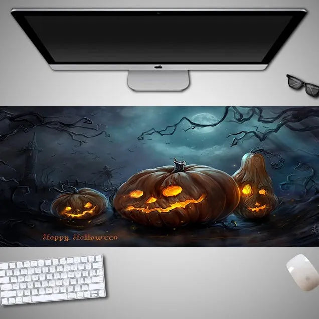 Oversized Halloween-themed gaming mouse pad with non-slip base on a desk.