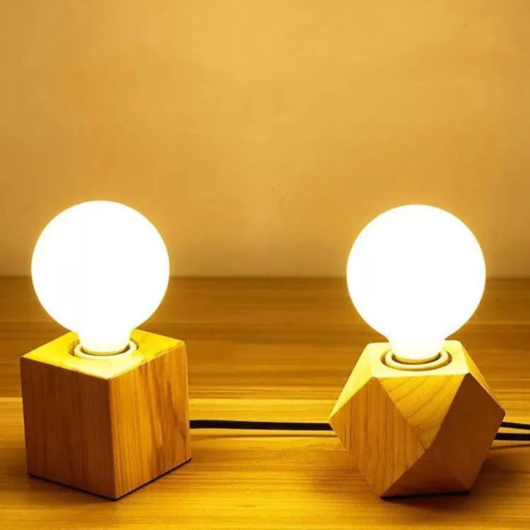 Retro wooden lamp holder with hanging wire in square and diamond shapes on a wood base.