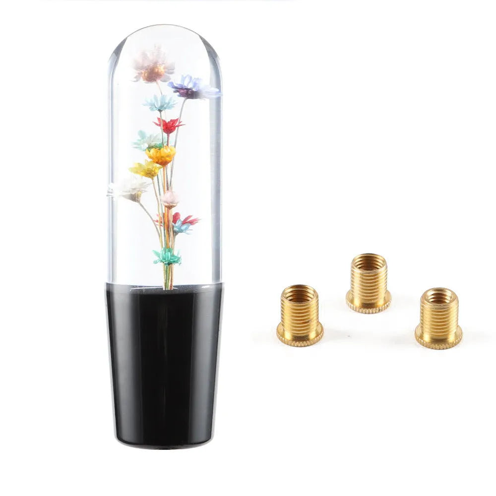 JDM crystal car gear knob with flower-in-water design, 15cm long, shown with three fitting adapters