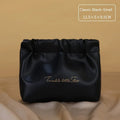 Large caramel mocha coloured leather-look travel toiletry bag with compartments open