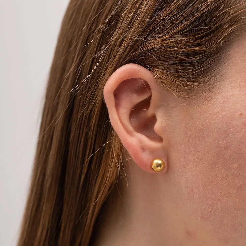 Stainless steel minimalist ball stud earrings in gold or silver, showing size comparison of 3mm, 4mm, 5mm and 6mm balls.