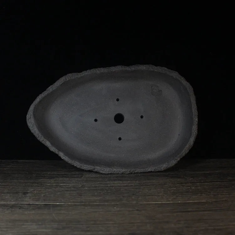 Handmade purple clay floor-standing flower pot in a choice of colours and sizes.