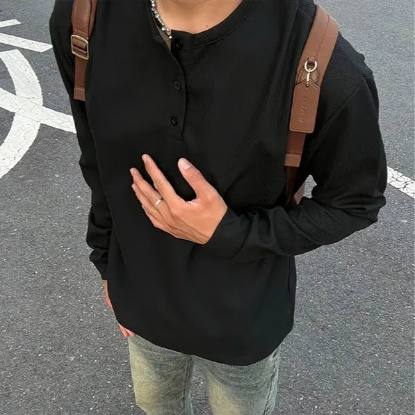 Men's black long-sleeved pullover top with Henry collar in loose fit for daily wear