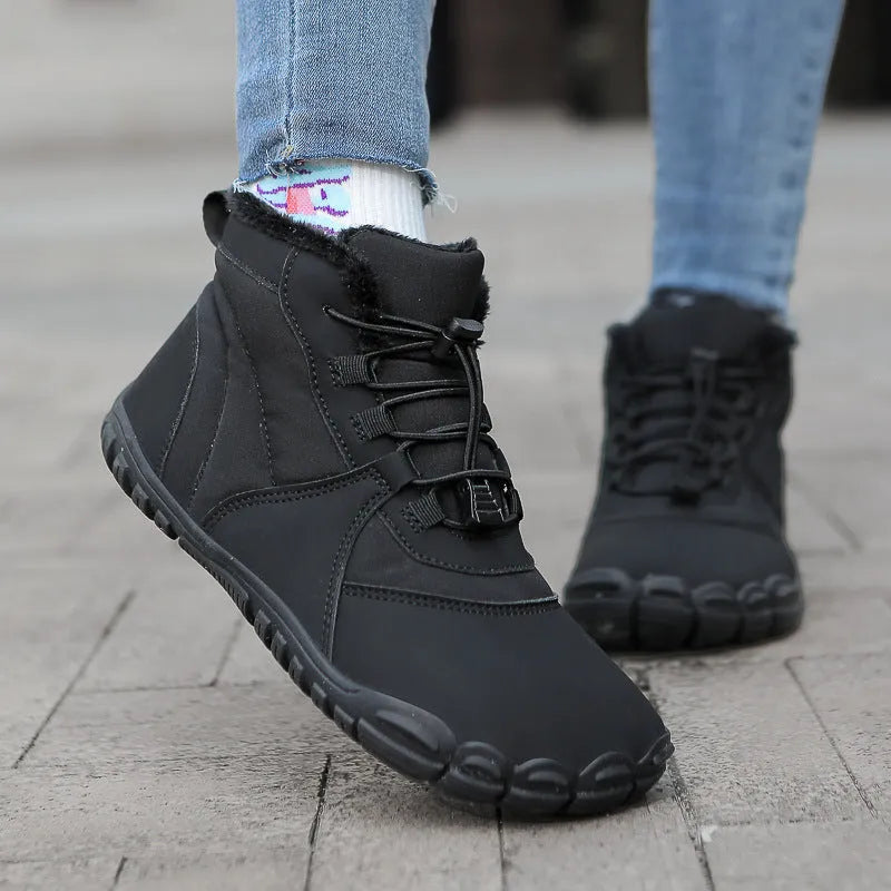 Unisex waterproof snow boots with fleece lining and a black rubber sole on a snowy background.