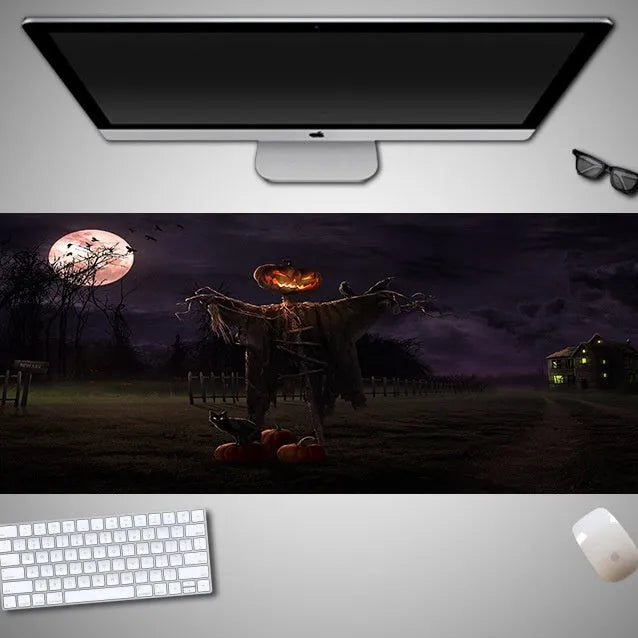 Oversized Halloween-themed gaming mouse pad with non-slip base on a desk.