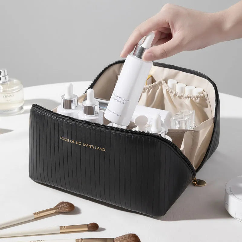 Vertical pattern pillow makeup bag in PU leather showing cubic shape and large storage capacity