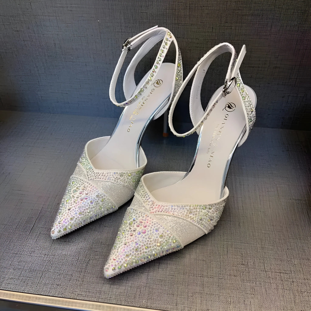 Women's black high heels with hollow stiletto heels and red soles, pointed toe design