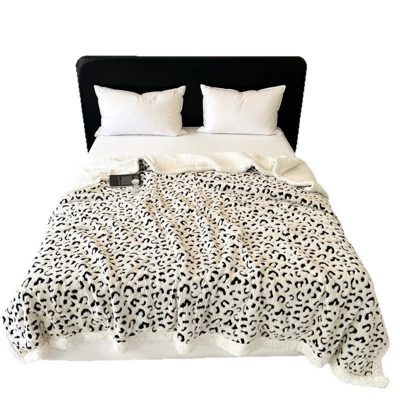 Double-layer cationic leopard jacquard taffeta blanket showing animal print pattern detail