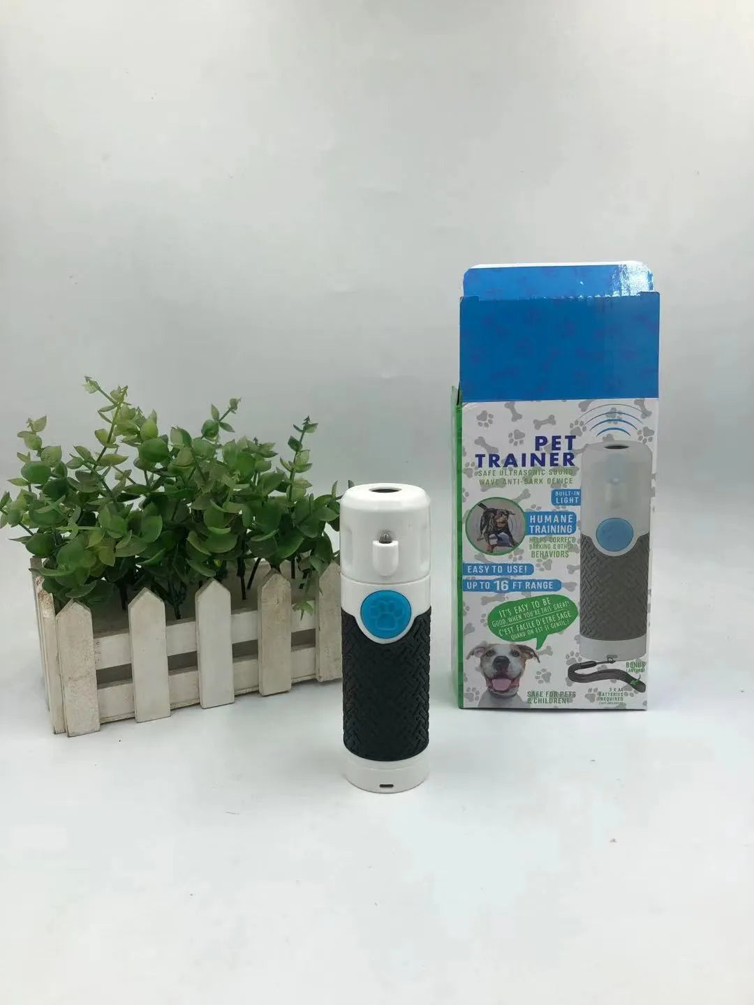 White handheld ultrasonic dog bark trainer with ABS plastic housing
