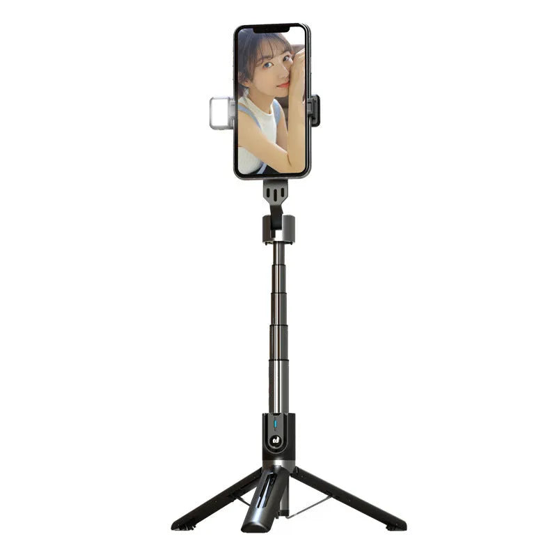 Bluetooth selfie stick with double fill light extended on desktop showing aluminium alloy arm and stand base
