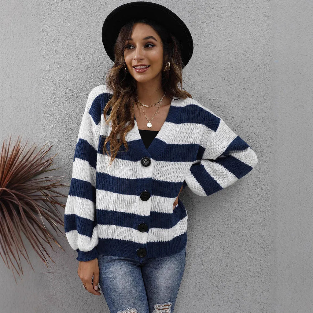 Women's striped cardigan sweater in deer plush polyester fabric on a hanger.