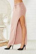 Acrylic slim-fit midi skirt with side split detail shown in black, grey and pink colour options
