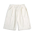 Cropped wide-leg workwear-style shorts in apricot, red, or army green with an elastic mid waistband.