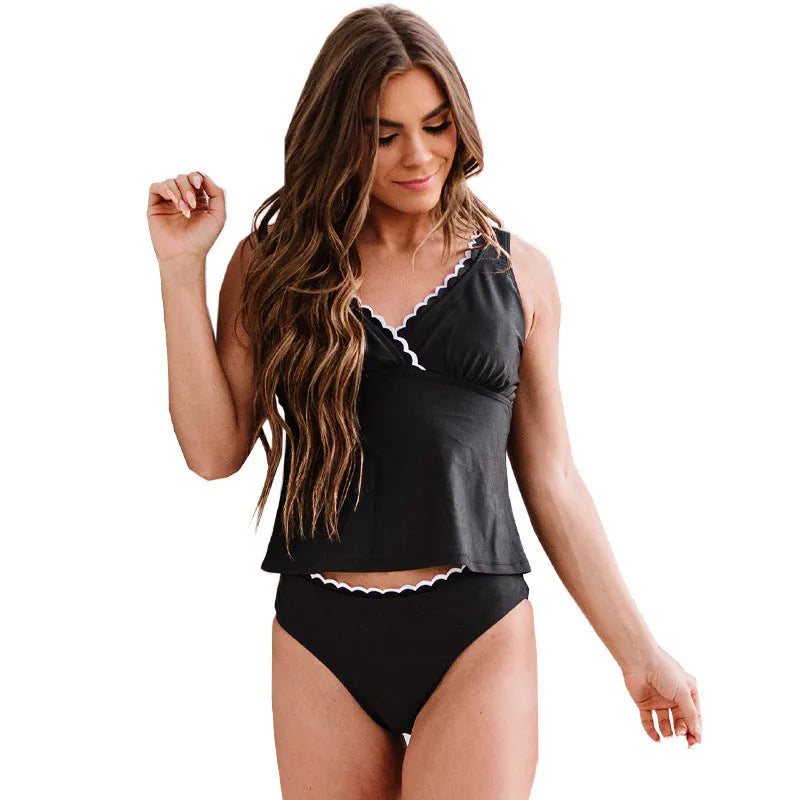 Black solid colour women's swimsuit bikini set with sleeveless design on mannequin