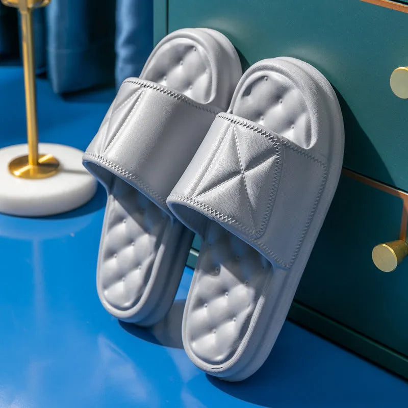 Pair of thick-sole non-slip EVA bathroom slippers shown in a choice of colours on a bathroom floor.
