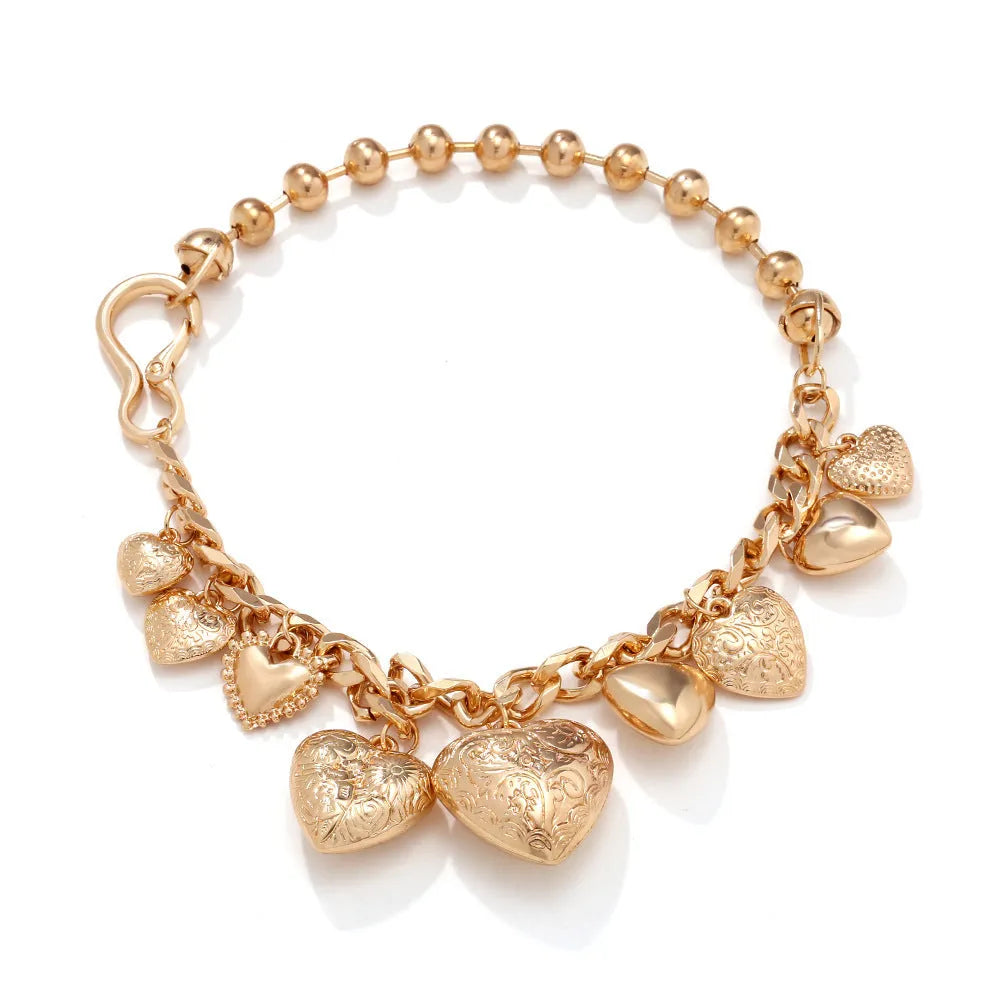 Gold carved heart pendant necklace on adjustable metal chain with exaggerated heart shape