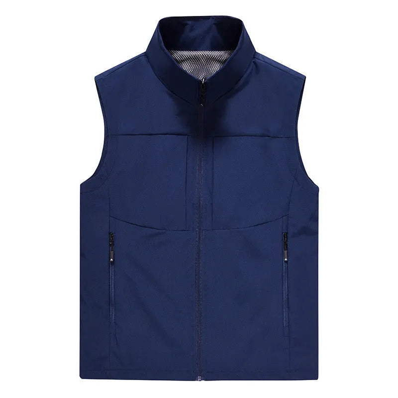 Man wearing a khaki stand collar cardigan vest with zipper pockets.
