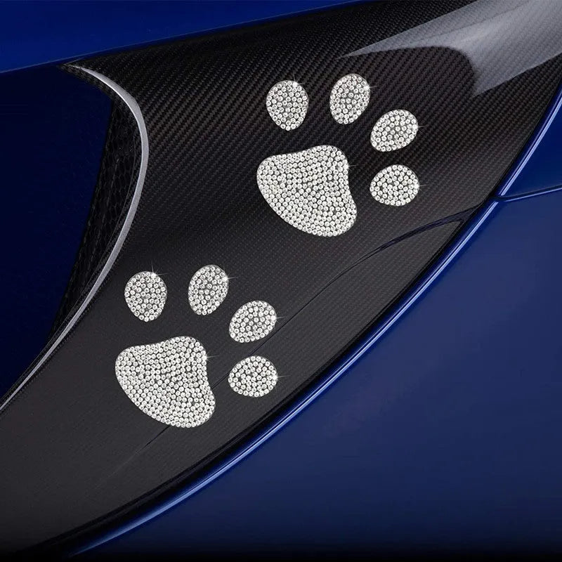 White diamond butterfly and bear claw design glass car sticker measuring 7 by 6 centimetres.