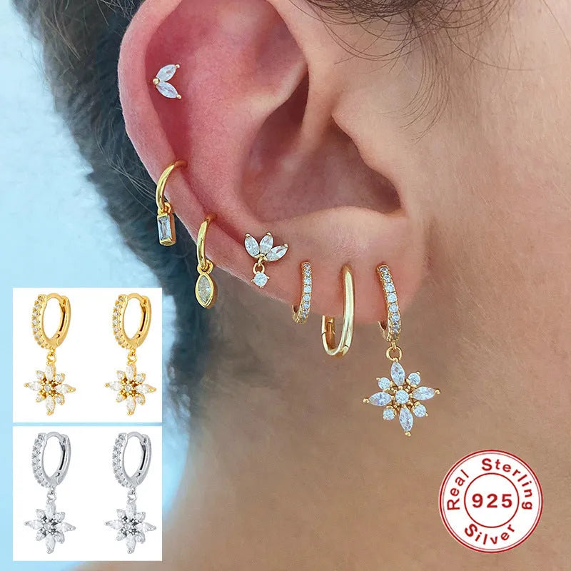 Sterling silver snowflake pendant earrings with diamond accents in white gold or yellow gold colour finish.