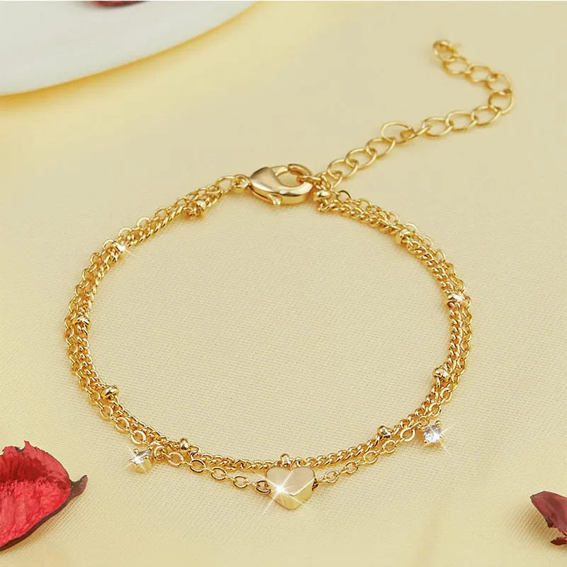 Heart-shaped zircon copper anklet in silver on display