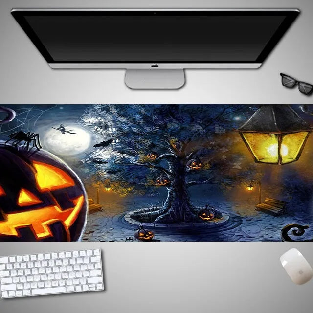Oversized Halloween-themed gaming mouse pad with non-slip base on a desk.