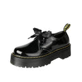 Women's thick soled leather shoes with cross straps and ribbons in black or white colours