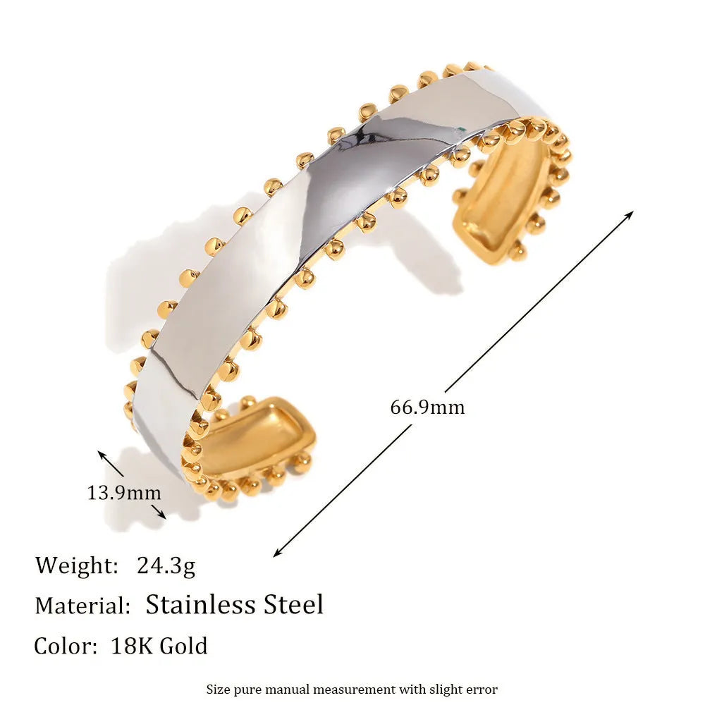 Gold electroplated geometric jewellery set with earrings, bracelet and necklace on white background