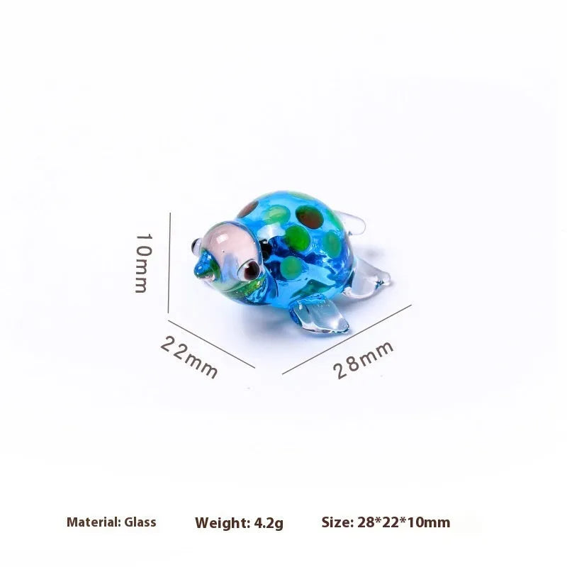 Glass turtle ornament with geometric modern design in six colour variations for desktop decoration