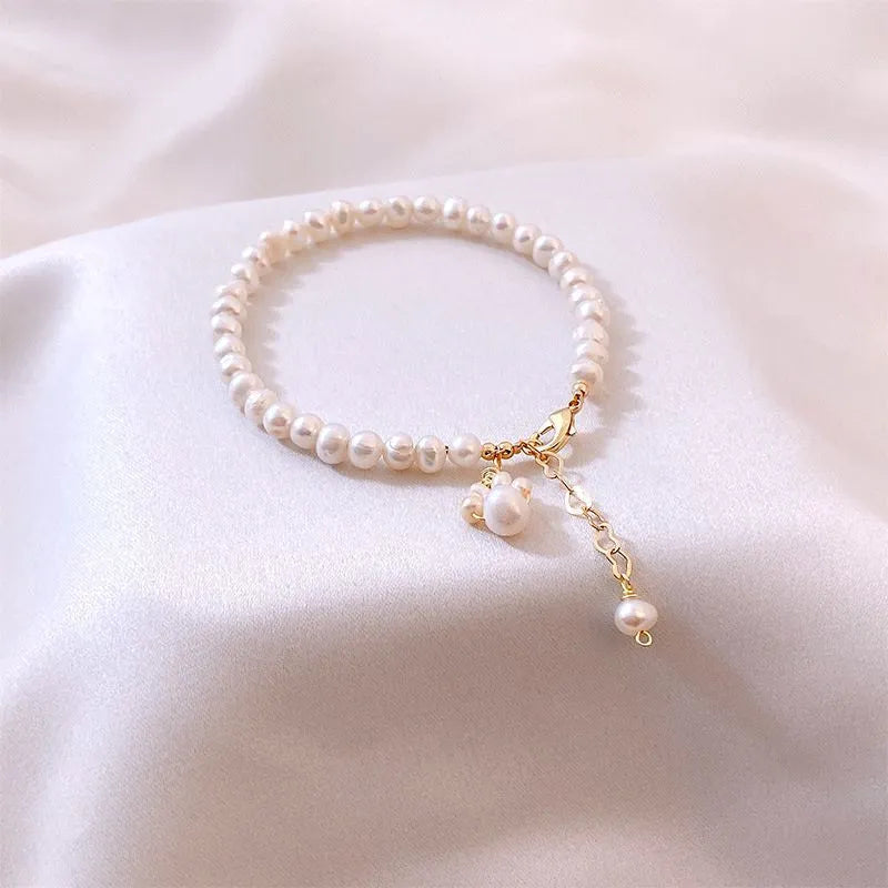 White freshwater pearl cat paw bracelet with electroplated finish for women