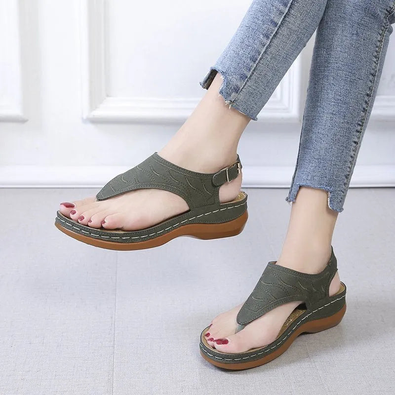 Women's casual wedge heel flip flop sandals with adjustable back strap in red vegan leather