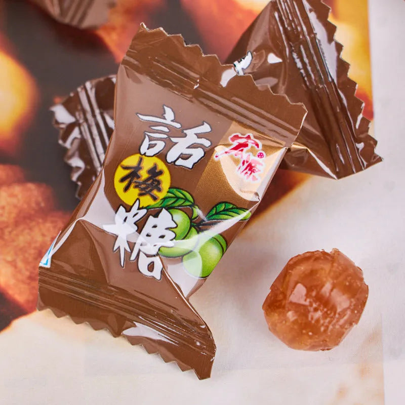 Bag containing three packets of hard candy: guava, plum sugar, and tangerine peel flavours.