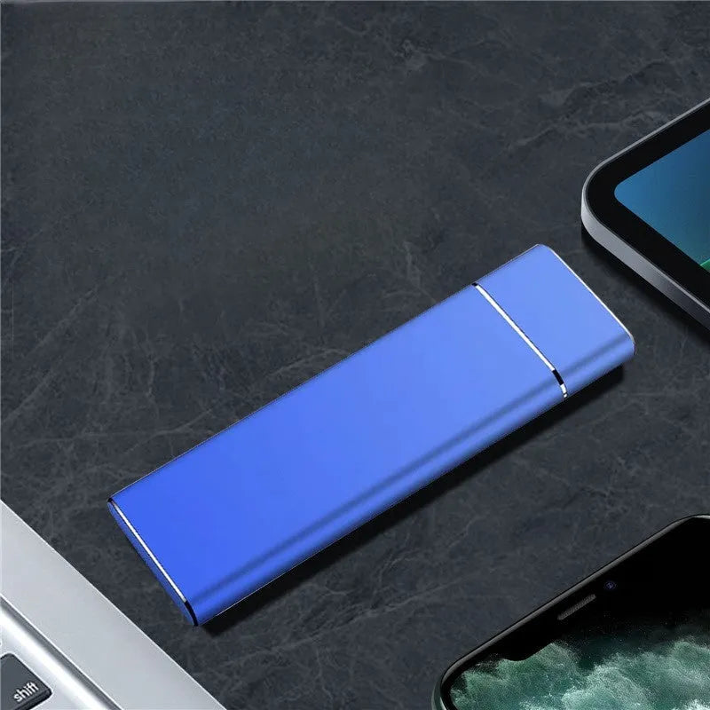Sapphire blue portable metal external hard drive with USB cable on a white background.
