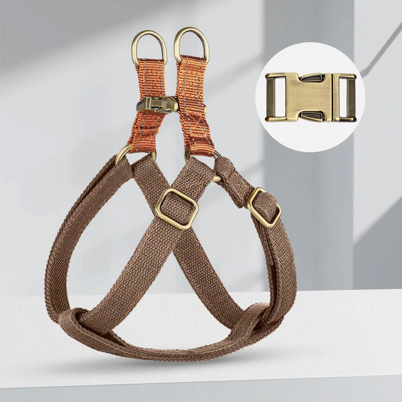Brown vest-style dog leash with cotton belt, nylon straps, and metal clasp.