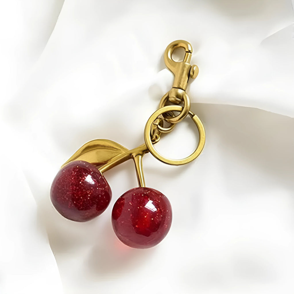 Three-dimensional cherry key ring in zinc alloy available in pink or red colours