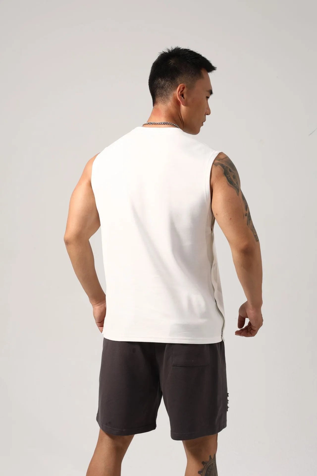 Men's Korean style loose fitness vest with two-side hidden hook opening in solid colour
