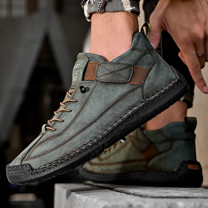 Men's mid-top casual boot in khaki with elastic band and tooling stitching detail.
