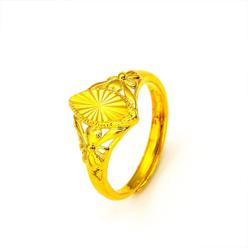 Gold open geometry ring with diamond flower pattern and textured botanical detailing