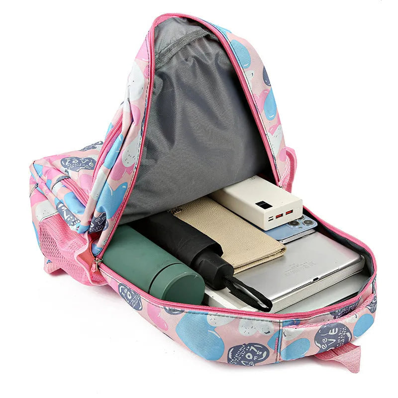 Blue Oxford cloth student backpack with air pillow shoulder straps shown open