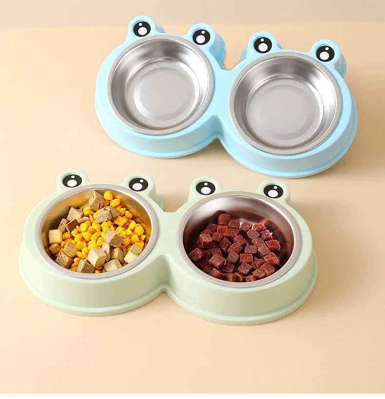 Stainless steel pet double bowl with frog design showing separate food and water compartments