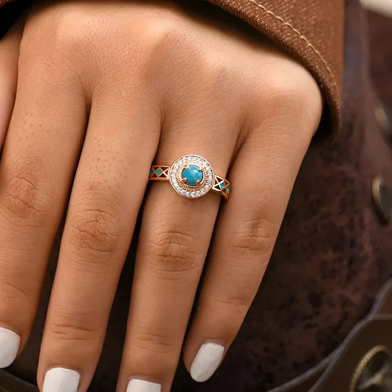 Rose gold geometric women's ring with turquoise inlaid zircon on a copper band.
