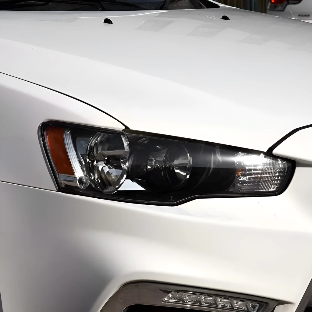 Transparent plastic headlight housing cover for vehicle lighting protection