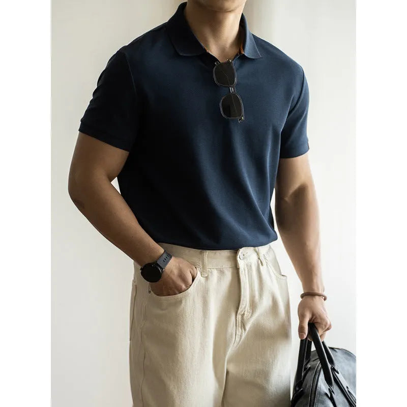 American-style short-sleeved polo shirt in a blue cotton-polyester blend on a hanger.