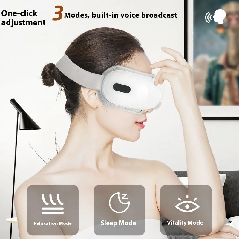 White rechargeable eye massager with airbag massage and hot compress functions on a plain background.