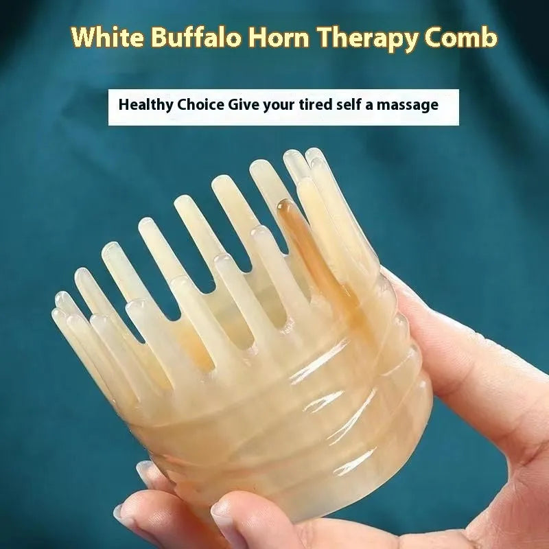 Black and white buffalo horn comb with wide teeth and a pointed end for hair massage and detangling.