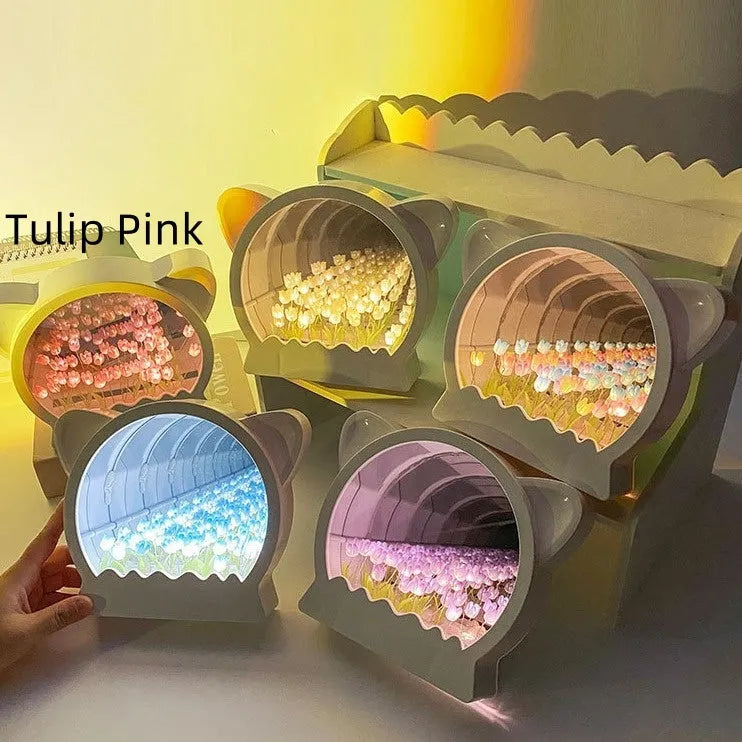Handmade DIY cat head shaped night lamp with a sea of colourful tulip flowers, shown in pink.