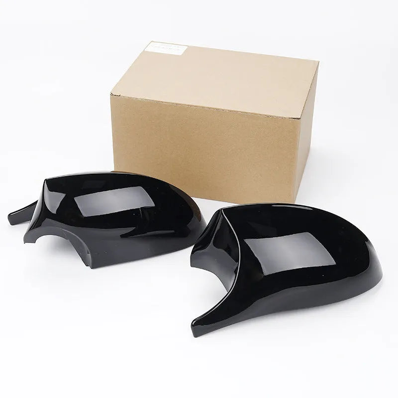 Pair of black ABS rearview mirror shells for BMW 3 Series E90, shown front and back.
